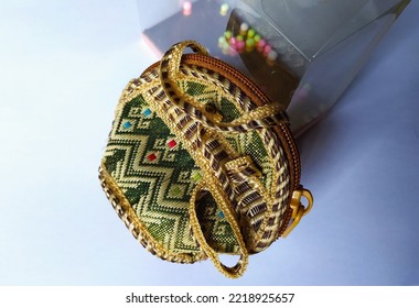 A Small Purse Of Wicker