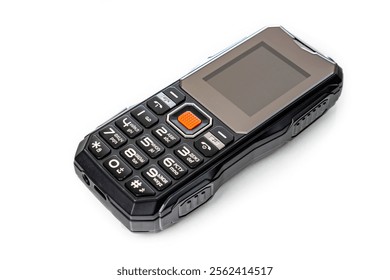 Small push-button cell phone on a white background. Obsolete model. Space for inscription, space for copying