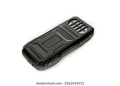 Small push-button cell phone on a white background. Obsolete model. Space for inscription, space for copying