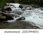 A small rapid in a stream from the mountains in northern Norway.Selective focus.