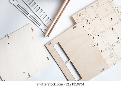 Small Ready-made Wooden Blanks For Assembling A Dollhouse On A White Background