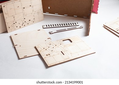 Small Ready-made Wooden Blanks For Assembling A Dollhouse On A White Background.