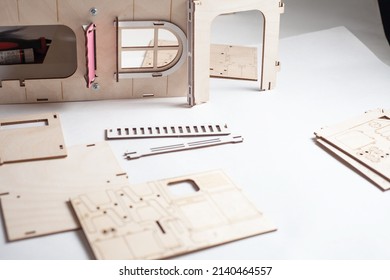 Small Ready-made Wooden Blanks For Assembling A Dollhouse On A White Background.