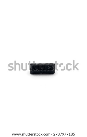 a small, rectangular black rubber bumper or cushion, designed for surface protection and vibration dampening