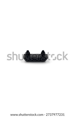 a small, rectangular black rubber bumper or cushion, designed for surface protection and vibration dampening