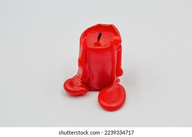 small red candle stub closeup on white background - Powered by Shutterstock