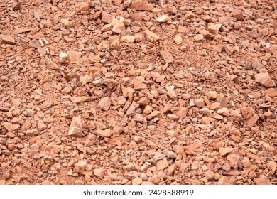 Small red clay brick pieces or broken bricks, known as brick khowa or churki in Bangladesh. Brick chips are usually made from picket bricks. These interfere with the casting of the building. - Powered by Shutterstock