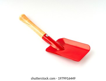 Small Red Color Shovel Isolated On White Background.