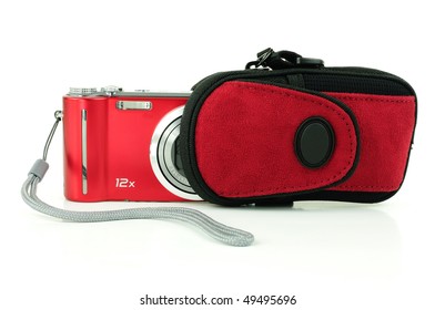 Small red compact digital camera being stored in a pouch for protection