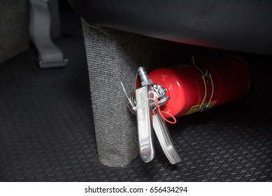 Small Red Fire Extinguisher In The Car To Prevent Emergencies.