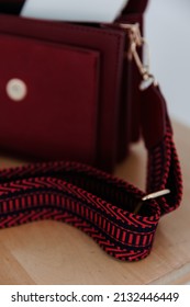 Small Red Handbag. Fashionable Women's Leather Clutch Bag With Fabric Strap.  Isolated On White Background. Traditional Clutch Bag With Brooch. Bag Made Of Red Genuine Fine Leather. Front View. 