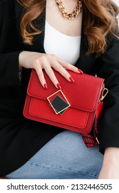 Small Red Handbag. Fashionable Women's Leather Clutch Bag With Fabric Strap.  Isolated On White Background. Traditional Clutch Bag With Brooch. Bag Made Of Red Genuine Fine Leather. Front View. 