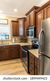 Small Renovated Dark Wood Kitchen With Center Island