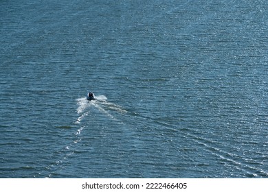 Small Rib Boat Cruising On A Fjord.