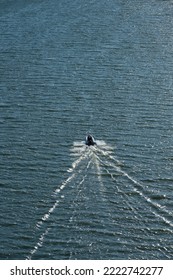 Small Rib Boat Cruising On A Fjord.