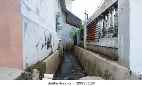 small river between two buildings