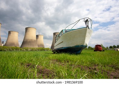 Small River Boat Near A Power Station