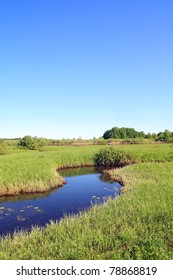 Small River On Green Field