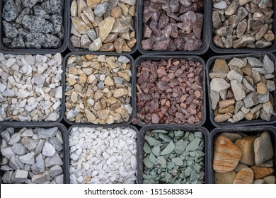 Small road stone background, dark gravel pebbles stone texture, granite, marble. Many type of gravel pebble for sell in market. Close up, top view