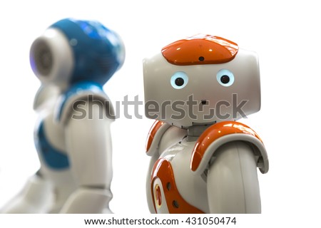 Small robots with human face and body - humanoid. Artificial Intelligence - AI. Orange and blue robots isolated on white background.