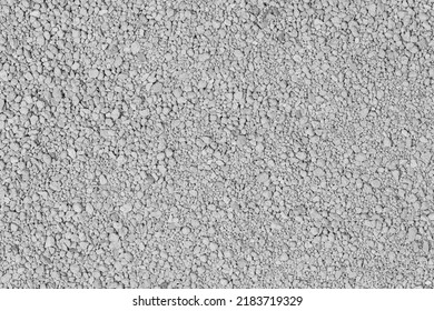 Small rocks ground texture background. white road stone. gravel pebbles stone texture. crushed granite. close up. grey clumping clay. cat litter