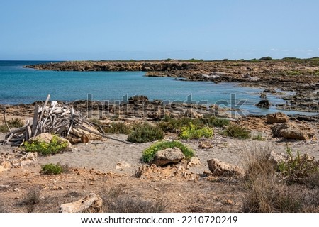 Small rocky beaches with clear and turquoise water in the natural oasis of Vendicari