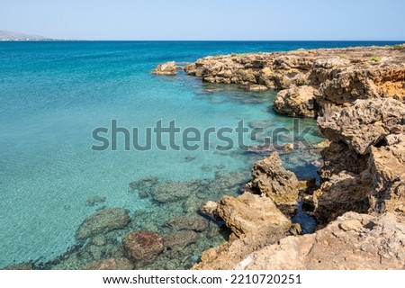 Small rocky beaches with clear and turquoise water in the natural oasis of Vendicari