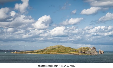 Small rocky island called Irelands Eye with Martello Tower, near Howth, Dublin, Ireland