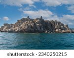 Small rocky island in the middle of the sea, Greece.