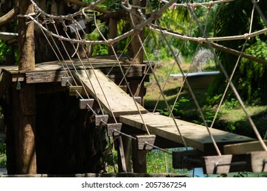 Small rope bridge made from wood, part of children playground, funny and adventure background concept