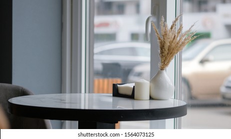 A Small Round Table In A Cozy Cafe.  Modern Cafe Interior