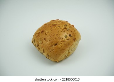 Small Round Wheat Bun Covered With Sesame Seeds, Close Up