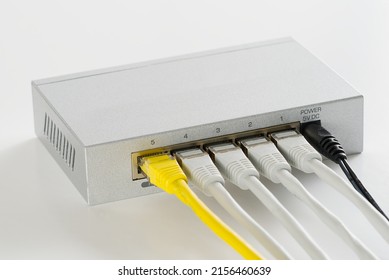 Small router and switch. tcp ip network business concept. High - performance gigabit switch. home network gray switch.