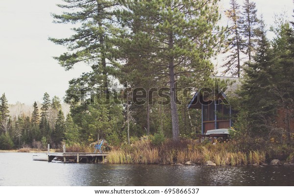 Small Rustic Cabin Sits On Lake Nature Parks Outdoor Stock Image