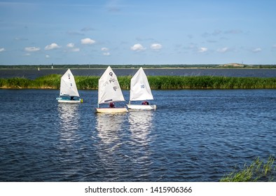 small sailboats on the water