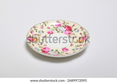 small saucers with a flower pattern