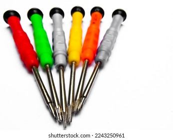 Small screwdrivers isolated on white background. Precision screwdriver, Selective focus