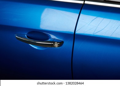 Small Scuffs And Scratches On Blue Car Paint 