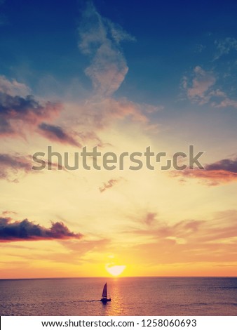 small ship on beautiful sunset,abstract meaning of brave in your own,belive in you self,Self esteem concept,vintage tone.