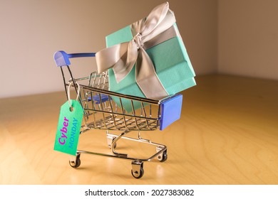 Small Shopping Cart With A Gift Inside And A Cyber Monday Frenzy Tag