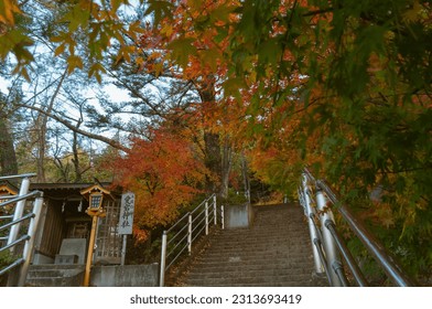 A small shrine and the stairs in the Arakurayama Sengen Park which is closed to the Mt. Fuji Japan. (愛宕神社 = Atago shrine)(火防の神 = God of firefighters)(賽錢 = donations)