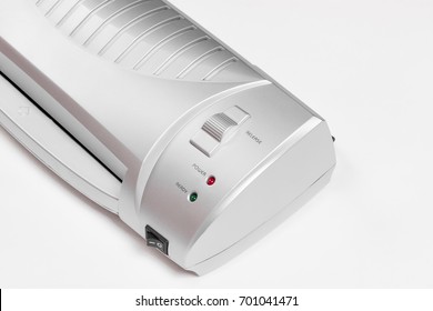 Small Silver Office Desktop Paper Laminator Isolated On A White Background