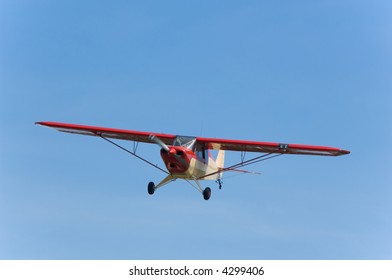 Small, Single Engine Airplane Against Blue Sky