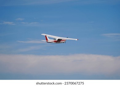A Small Single Engine Airplane Flying Through a Clear Sky