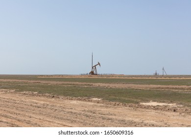 Small Single Oil Derrick, Oil Platform In Kazakhstan Steppes