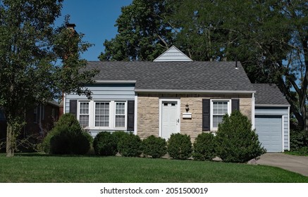 Small Single Story, Stone Front House With Shrubs