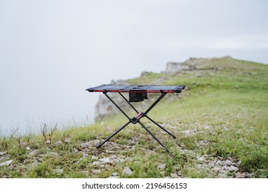 Small size frame table for camping, furniture made of light materials, trekking in the mountains, table for eating, tourist equipment. High quality photo