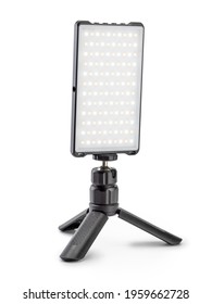 Small size led lamp for photo and video production stands on a tripod
