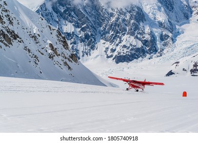 A Small Ski Plane Departing From The Denali Base Camp. The Runway Is On A Glacier. 