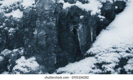 Small Snowy Frozen Waterfall With Icicle.
Macro Photography